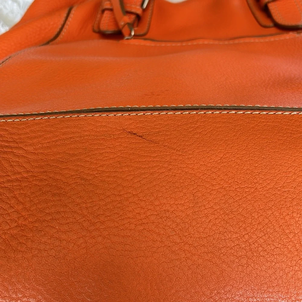 Large leather Cole Haan orange shoulder bag with silver hardware buckles. - Picture 12 of 16